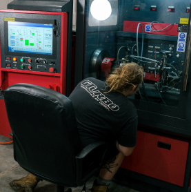 man operating dyno tuning computer