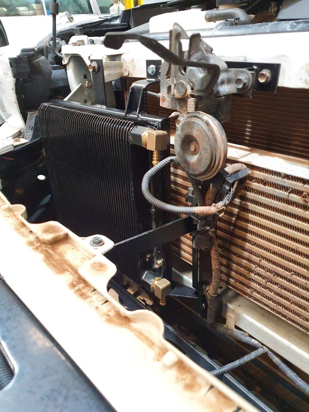 PDI Hilux transmission cooler fitted, side view